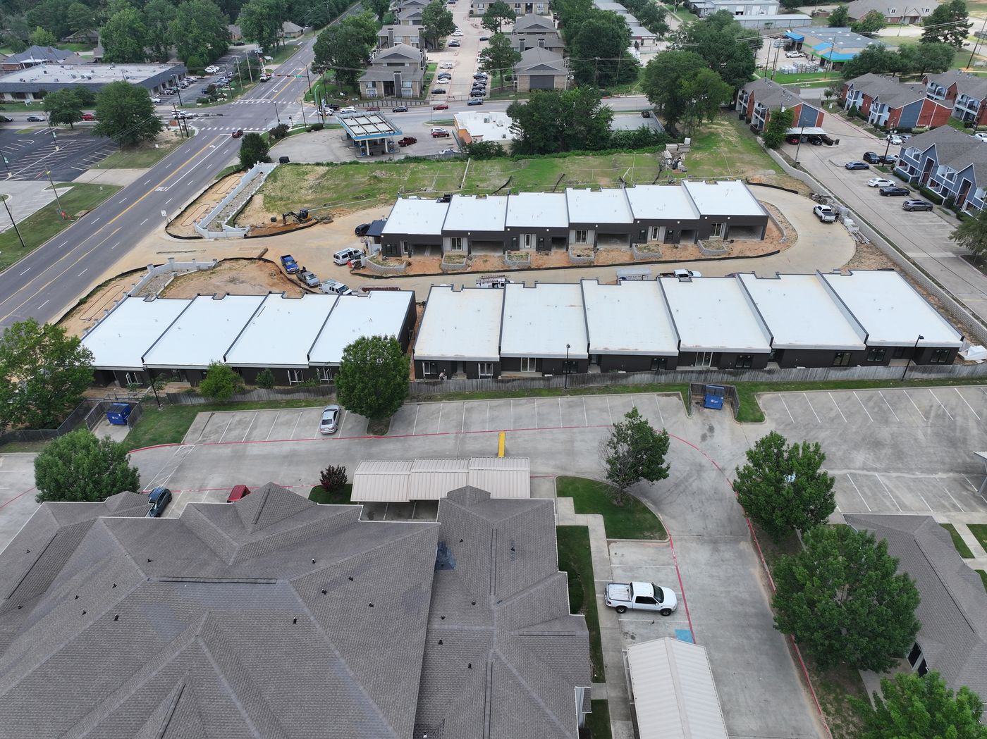 Aerial of a row of modern townhomes under construction