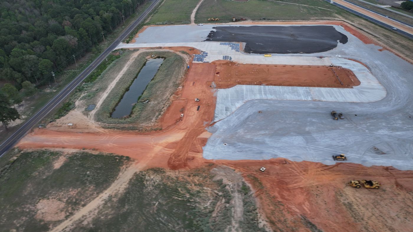 Aerial of a large commercial site with paving underway